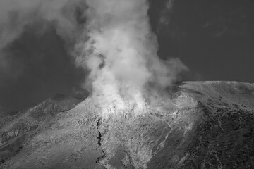 black and white of Sulfur smoke on the top of Mount Welirang, East Java, Indonesia. Mount Welirang is an active volcano with an altitude of 3156m above sea level