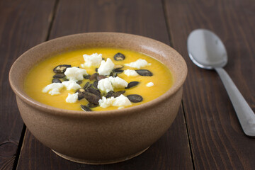 Pumpkin cream soup with a sheep cheese and pumpkin seeds