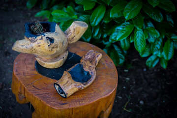 example of handicrafts made of rustic wood by a craftsman to effect the garden and outdoor areas. Sustainable craftsmanship with reusable wood