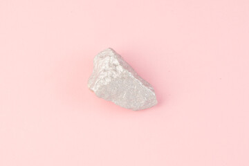 Rock on pink background top view