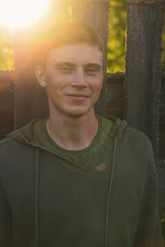 Green-eyed country boy at sunset