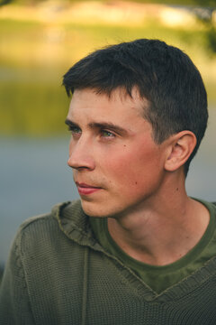 Green-eyed country boy at sunset