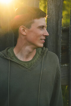 Green-eyed country boy at sunset