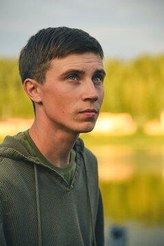 Green-eyed country boy at sunset