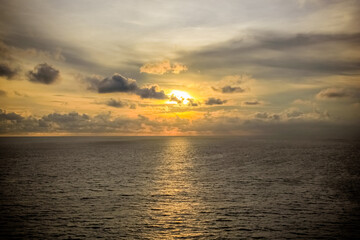 Dramatic sunset sky with clouds.Sunset ocean tranquil scene.Fantastic view of the dark overcast...