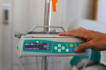 a caregiver programs an infusomat