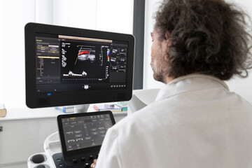 a neurologist gives an ultrasound to a patient