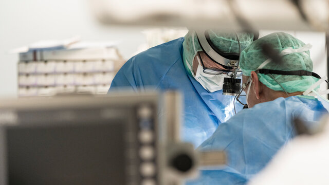 two surgeons in the operating room during surgery