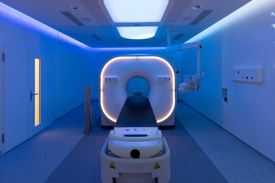 view of a scanner room bathed in blue light