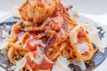 Spaghetti with prawns, sea scallops and parmesan