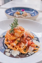 Spaghetti with prawns, sea scallops and parmesan