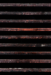 Rusty metal rods isolated on black background poverty prison age retro concept in urban scene