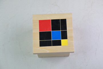 Montessori binomial and trinomial cubes 