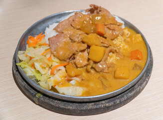Curry and salad with pork cutlet.