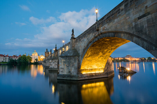 Illuminated Charles bridge with reflections at night, Prague, Bohemia, Czech Republic