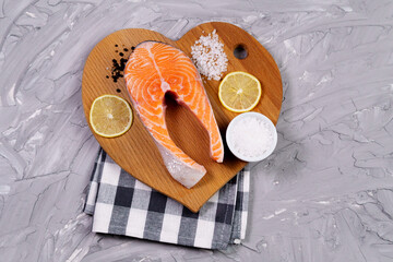 Fresh raw salmon steak, sea salt, lemon, spices. Ingredients set for making healthy dinner. Healthy...