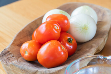 tomatoes and onion on a close-up table top