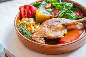 Hot fried chicken legs with grilled pineapple and Strawberry,Tomato with vegetable