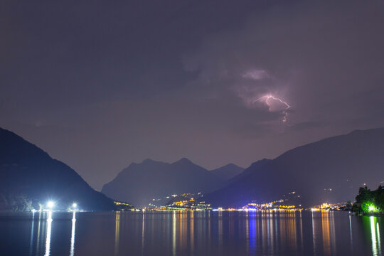 An evening lightning storm brewing above Lago D'Iseo in Italy