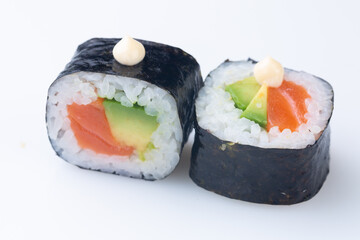 traditional Japanese cuisine. japanese sushi isolated on white background. maki sushi with salmon, avocado, soft cheese (Philadelphia)