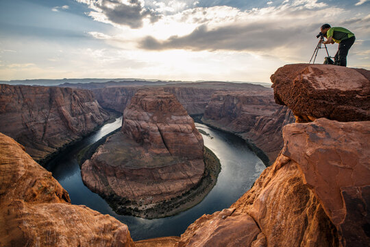 Photographer at Horseshoe Bend on the Colorado River in Arizona.