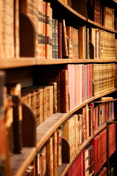 Old hardcover books on shelves