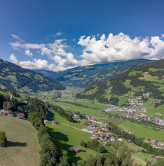 Aerial drone shot of Zillertal valley with clouds in Tyrol Austria summer