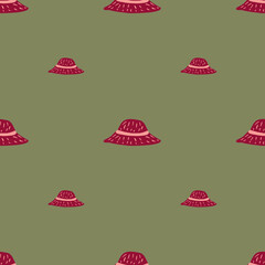 Pink summer headdress seamless pattern with simple panamas silhouettes. Olive green background.