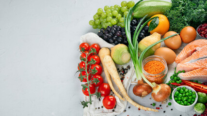 Selection of organic healthy products on gray background product.