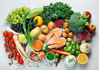 Selection of organic healthy products on gray background product.