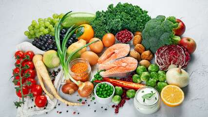 Selection of organic healthy products on gray background product.