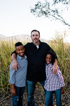 Father Posing with Sons at Park in Chula Vista