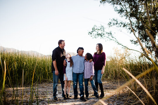 Family of Five Standing Together at Park in Chula Vista