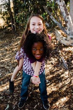Brother & Sister Piggy Back Ride at Park in Chula Vista