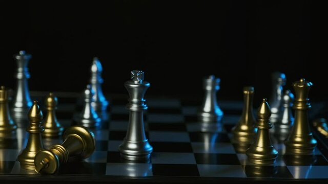 Close up of businessman moving white king defeating black king of opponent during chess game,Planning and strategy ideas