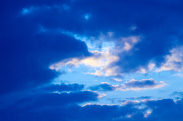 Naklejka na ściany i meble Blue sky is visible behind the clouds