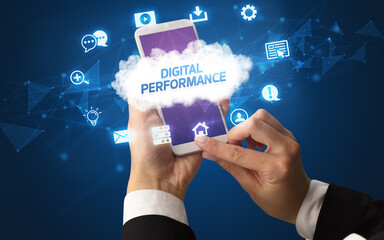 Female hand holding smartphone with DIGITAL PERFORMANCE inscription, cloud technology concept