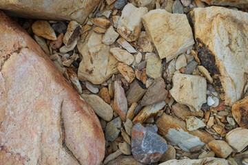 Closeup natural rock stone with mineral on walkway at beach