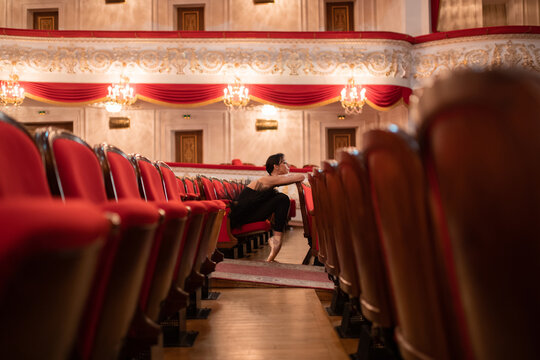 Female ballet dancer waiting for performance in auditorium