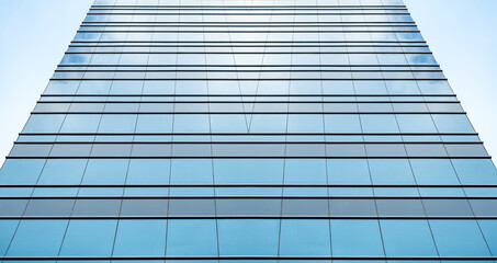 Obraz premium underside panoramic and perspective view to steel blue glass high rise building skyscrapers, business concept of successful industrial architecture
