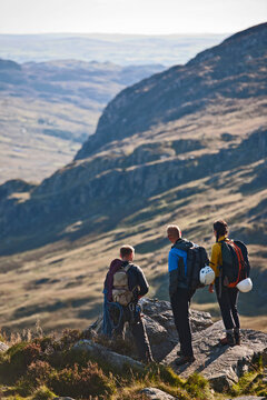 group of rock climbers at viewpoint on Tryfan in North Wales