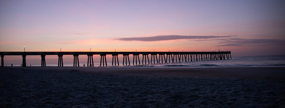 Silhoutted Ocean Pier at Sunrise