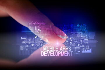 Naklejka premium Finger touching tablet with web technology icons and MOBILE APPS DEVELOPMENT inscription