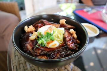 pork ,rice topped with pork and egg
