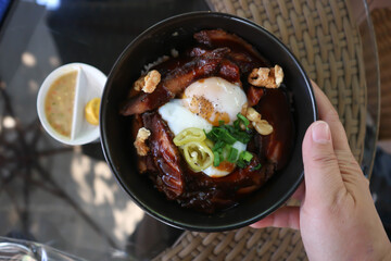 pork ,rice topped with pork and egg