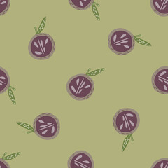 Apple half shapes with seeds in purple tones seamless pattern. Pastel green background. Random print.