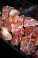 Raw meat covered with cooking spice