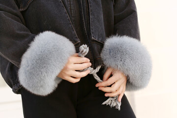  warm denim jacket with fur cuffs detail close up photo