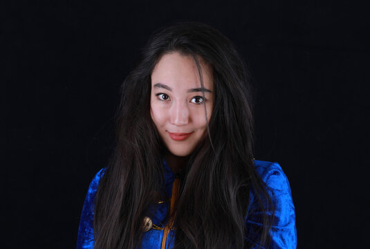 studio portrait of a young beautiful asian woman, kazakh girl