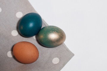 painted easter eggs on a gray napkin